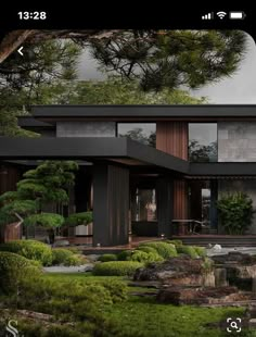 a modern house surrounded by trees and rocks