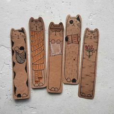 three wooden bookmarks with cats on them