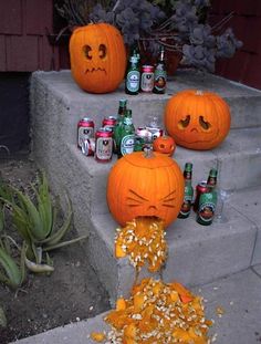 two pumpkins that have been carved to look like they're eating something out of a can