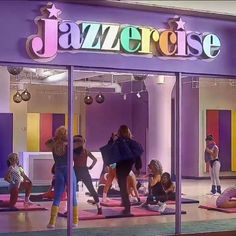 a group of people doing yoga in front of a store