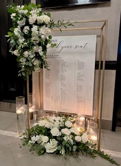 a table with flowers and candles on it