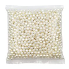 white pearls in a plastic bag on a white background