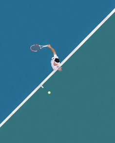 a man hitting a tennis ball with a racquet on top of a court