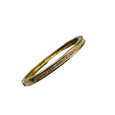 This vintage gold-tone hinged bangle features a row of sparkling rhinestones, offering a timeless and elegant accessory with a touch of antique charm. * Gold-tone finish * Rhinestone embellishments * Hinged closure  * Inner diameter approx. 2.25 inches Metal wear visible on close inspection. Features: * bracelet Size: Womens 2.25" x 2" Condition: Pre-Owned Good Please be aware that pictures are an important part of my description, please look at all photos and zoom in if needed.  All my items ar Bracelets Design, Vintage Bangles, Rhinestone Embellishments, Bangle Designs, Hinged Bangle, Elegant Accessories, Antique Items, Women Accessories Jewelry, Bracelet Sizes