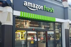 an amazon fresh store front with green awning