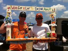 two men standing next to each other in front of a sign that says we've got a lot of dickin about