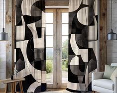 an open door with black and white curtains