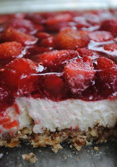 a close up of a dessert with strawberries on top