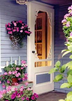 the front door is decorated with pink flowers