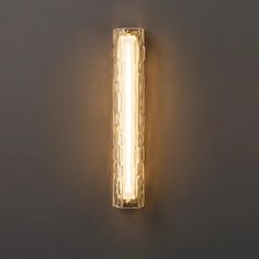 a light that is on the side of a wall with lights attached to it's sides