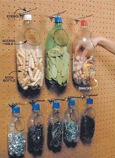 several bottles filled with different types of beads and other things in them on a pegboard