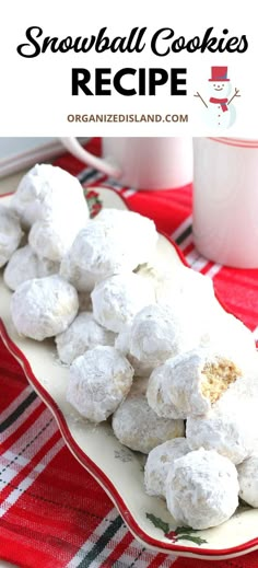 a plate full of snowball cookies on top of a table