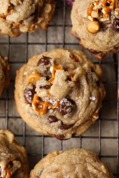 cookies with chocolate chips and caramel are on a cooling rack