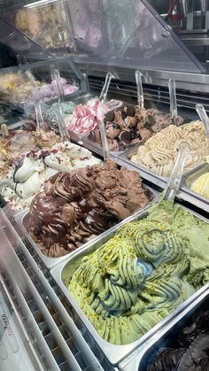 a display case filled with lots of different types of ice cream