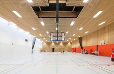 an indoor basketball court is shown in this image