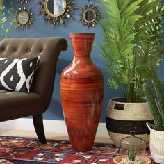 a living room filled with lots of furniture next to a potted plant and mirror