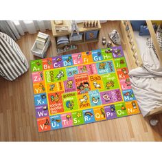 a child's play mat with numbers, letters and shapes on the floor in a bedroom