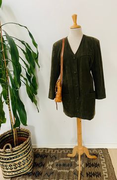 "Oh my goddess! This jacket is pure vintage goodness! Vintage dark green velveteen in a kind of trench style Lovely coordinated satin lining and covered buttons Pockets! Three quarter sleeves A little tomboy, a little boho, a little folksy. Right on trend. So perfect for a night out! With jeans or a dress. You'll turn heads and collect compliments no matter what you pair this jacket with! Size small Measures: 20\" from armpit to armpit across the chest 31\"from top of the shoulder to bottom hem Classic Velvet Outerwear With Button Closure, Chinoiserie Dress, Vintage Dark Wash Cotton Outerwear, Vintage Dark Wash Long-sleeved Outerwear, Vintage Wool Vest, Vintage Green Outerwear With Button Closure, Black Vintage Velvet Outerwear, Yellow Cardigan, Oh My Goddess