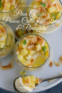 four glasses filled with pineapple and custard desserts on top of a white plate