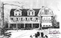 an old black and white photo of a large house with two storyed houses in the snow