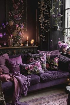 a living room filled with lots of purple furniture