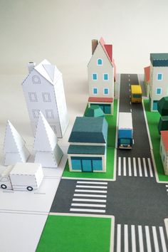 a paper city with buildings and cars on the road