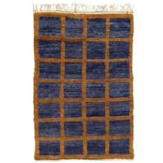 an orange and blue rug with squares on it