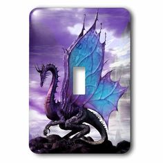 a light switch cover with a blue dragon on it's back and purple clouds in the background