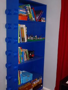 a blue book shelf filled with lots of books