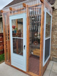 a wooden structure with glass doors on the outside