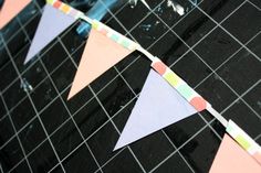 there are some paper triangles on the table