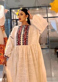 Bohemian Cotton Handloom Dress, Bohemian Cotton Dress With Weaving Work, White Handloom Summer Dress, Spring Cotton Handloom Dresses, Bohemian Long Sleeve Embroidered Dress With Woven Motifs, Long Dresses With Woven Motifs, Folk Dresses With Woven Motifs And Long Sleeves, White Folk Dress With Weaving Work, Folk Style Tunic Dress With Woven Motifs