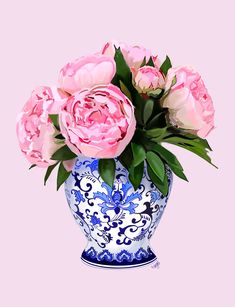 a blue and white vase with pink flowers in it