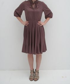 Brown Pleated Dress with Tie Collar Elasticated Waist Loose Sleeves Made by Touch of Class Waist - 28 - 36 Inches Bust - 36 Inches Hips - Loose Length - 40 Inches Sleeves - 17 Inches Model is 5'11' US Size 6 AUS/UK Size 10 EU Size 40 Dress fit model well. Summer Brown Pleated Dress, Fitted Brown Pleated Midi Dress, Elegant Brown Pleated Midi Dress, Pleated Mid-length Daywear Dress, Brown Pleated Midi-length Dress, Mocha Dress, Sheer Floral Top, Buy Clothes Online, 40 Dress