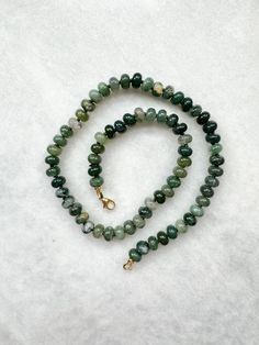 Moss Agate rondelle hand knotted necklace finished with a gold vermeil lobster clasp necklace length on the photos: 45 cm / 18" bead size: 8 mm hand knotted on dark green silk thread Please note that due to the fact these are natural gemstones the colours may vary with each necklace. Keep away from water. Avoid direct contact with perfumes and chemicals. Remove before showering or swimming. Sparkling Accessories, Hand Knotted Jewelry, Executive Fashion, Hand Knotted Necklace, Knotted Necklace, Green Beaded Necklace, Jewelry Knots, Clasp Necklace, Necklace Design