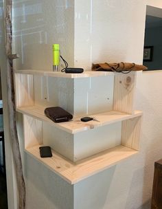 there are three shelves with cell phones on them