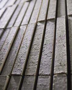 a close up view of the side of a building that has been made out of concrete blocks