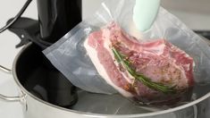 a piece of meat is being prepared in a pot