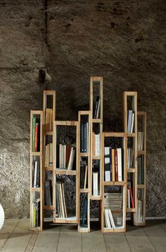 the bookshelf is made out of wooden crates