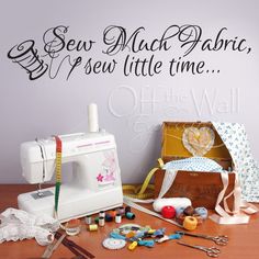 sewing supplies and wall decals on a table with the words sew much fabric, sew little time