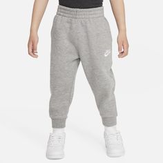 These joggers are made of soft fleece fabric for lightweight warmth. The stretch waistband helps kiddos get a comfy fit and the tapered legs are nice and cozy while providing freedom of play. Pair with any of the Nike Sportswear Club Hoodies or tees for a coordinated look. Joggers Nike, Children Outfits, Nike Sportswear Club Fleece, Toddler Pants, Fleece Joggers, Comfy Fits, Nike Sportswear, Fleece Fabric, Tapered Legs