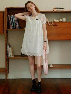 This product, the Cest Baby Doll Lace Dress, embodies a sweet and youthful charm with its delicate lace detailing. The flowy and loose fit provides both comfort and a whimsical aesthetic, perfect for a casual day out or a special occasion. The intricate lace design adds an element of sophistication to this playful dress. - This dress features a baby doll silhouette, offering a relaxed and airy fit.- The lace detailing throughout the dress enhances its delicate and feminine appeal.- Puff sleeves add a touch of vintage charm, complementing the overall design.- The scalloped lace hemline adds a refined finishing touch.- Made from soft, breathable fabric, it ensures comfort while maintaining style. Cute Lace Mini Dress For Brunch, Cute Lace Mini Dress For Spring, Cute Spring Lace Mini Dress, Cute Lace Dress For Brunch, Casual Lace Dress For Day Out, Feminine Lace Patchwork Mini Dress With Short Sleeves, Feminine Mini Dress With Lace Patchwork, Feminine Short Sleeve Mini Dress With Lace Patchwork, Feminine Lace Dress With Lace Collar