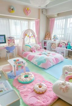 a bedroom with pink and blue carpet, white bedding, desks and toys