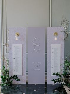 an aisle decorated with flowers and greenery next to two large white signs that say i love you