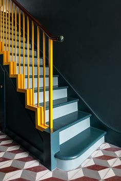 the stairs are painted yellow and blue