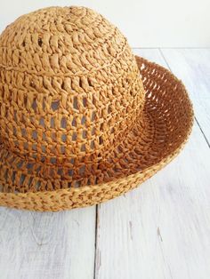 Summer hat made of raffia. Made from 100% natural raffia. Lightweight and folds well, easy to take on the road.  Can be worn with the brim lowered as a bucket hat or as a straw hat with curled edges.  Has a removable brooch. Can be washed by hand in cold water, without twisting, after drying, steam off with an iron. Suitable for head size 54-56cm If you need another size, please send me a message. Crochet Mens, Curled Edges, Handmade Mittens, Raffia Hat, Cozy Candles, Candle Cover, Fingerless Mittens, Summer Hat, Summer Hats