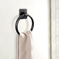 a towel hanging from a hook on a wall