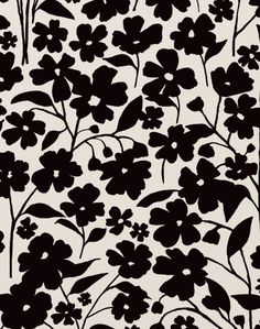 a black and white flower pattern on a wall