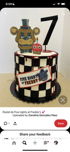 a cake that is decorated to look like a teddy bear and the number seven on it