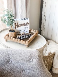 a tray with some plants on it and a sign that says home is our favorite place